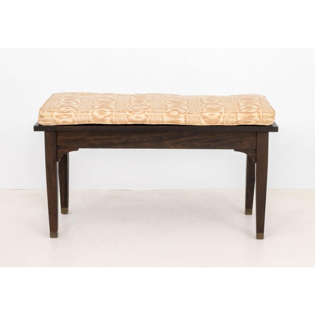 Mid-Century Modern Tonkbench Wooden Piano Bench, circa 1940, with beige upholstered cushion and the top lifting to storage...