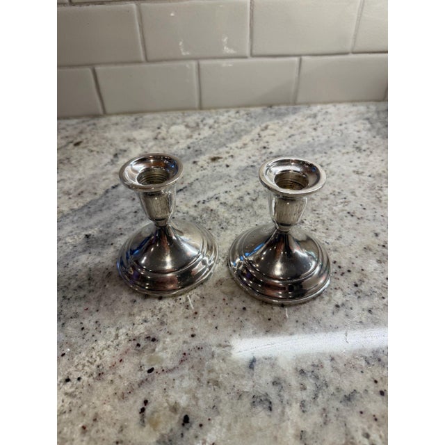 Pair of Towle sterling silver candlesticks. 4" tall x 3.5" base. Made by Towle Silversmiths, circa 20th century USA....