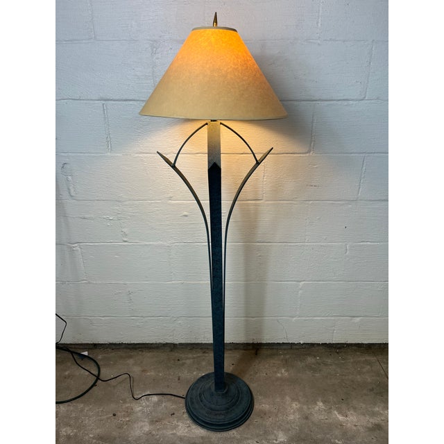 This striking floor lamp is a masterclass in Mid-Century Modern sculptural design. Reminiscent of the organic, upward-...