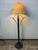 This striking floor lamp is a masterclass in Mid-Century Modern sculptural design. Reminiscent of the organic, upward-...