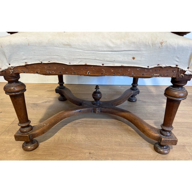 This beautiful pair of high back armchairs is made of walnut. It is a French work in the Louis XIII style. Circa 1880.