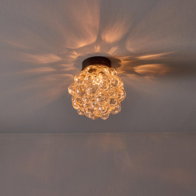 Helena Tynell Bubble Glass Wall or Ceiling Lamp Executed in thick and heavy textured light bubble glass and original black...