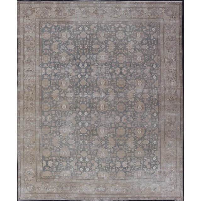 Measures: 9'8 x 12'5 Antique Distressed Tabriz Rug in Teal , Light Brown, Taupe with an all over Design. Keivan Woven Arts...