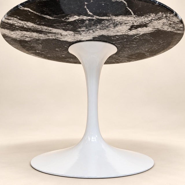 Tulip-base side table designed by Eero Saarinen, from the Pedestal collection produced from 1956 onwards, exhibiting all...