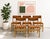 Set of five Mid Century Modern Dining Chairs featuring solid oak frames and original textured wool upholstery in a warm...
