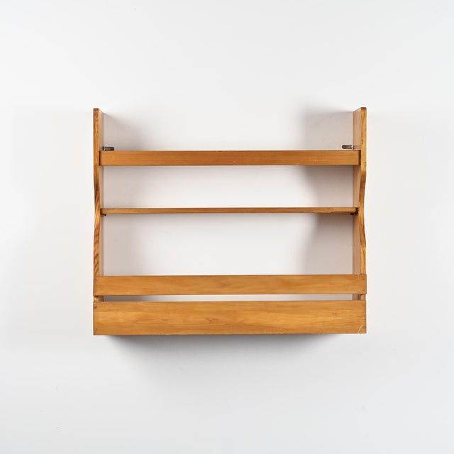 Wall-mounted pine sideboard by Charlotte Perriand, from the Les Belles Challes residence in Arc 1800. Originally created...