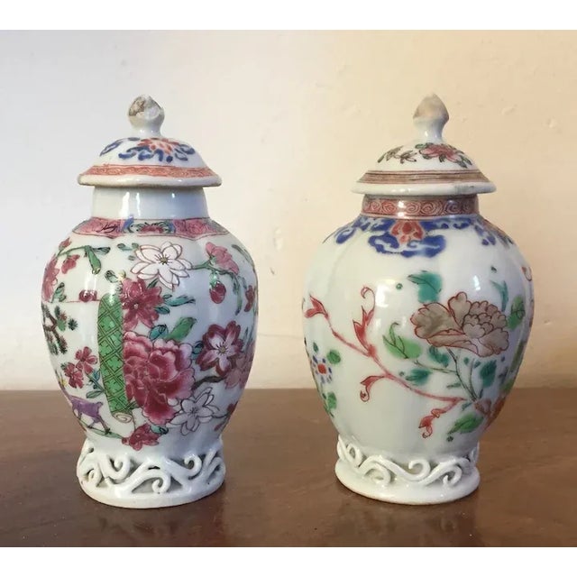 Each caddy with melon or lobed vase shape and smoke tendril scroll worked porcelain accented feet. Good condition with...