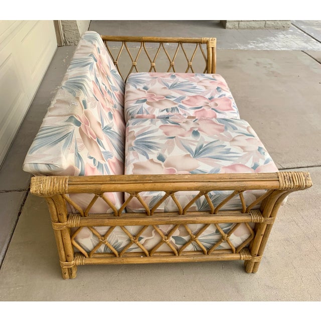 A solidly made 1970s bamboo and rattan, upholstered sofa. The frame is in excellent condition without splits or missing...
