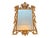 A striking antique giltwood wall mirror featuring an exceptionally ornate hand-carved openwork frame with scrolling...