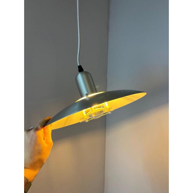 This classic pendant lamp from the Danish manufacturer Jeka is a timeless example of high-quality Scandinavian design and...