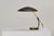 A rare desk lamp designed by Christian Dell for Kaiser Leuchten in the 1950s. The lamp has a light feel, accentuated by...