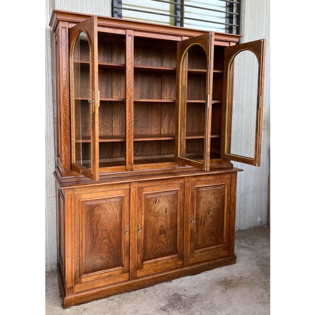 20th century Spanish cupboard or bookcase with three glass vitrines, constructed from a pine called "mobila" and original...