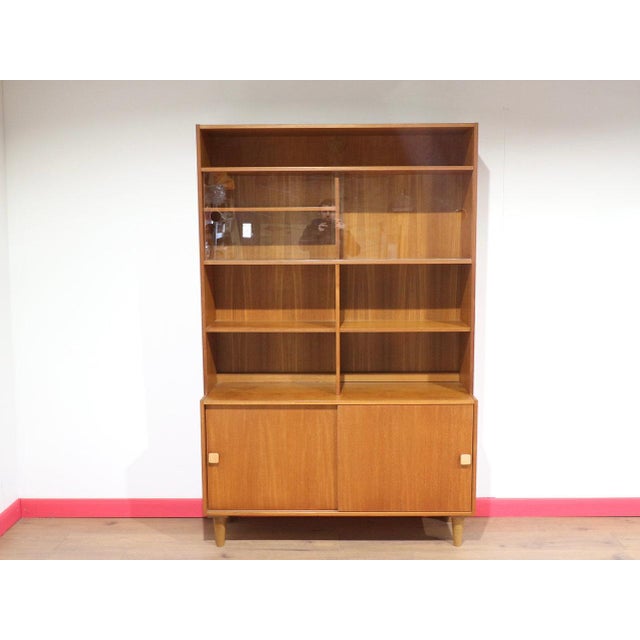 A beautiful Scandinavian display cabinet by Domino Mobler, this Danish teak piece offers both style and function, making...