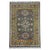 A slate gray field sets off three stylized floral medallions in cream, blue, rust, and burgundy. Smaller flowers fill the...