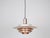 The lamp's form was designed based on the principle of a reflective system that directs light not only downward but also...