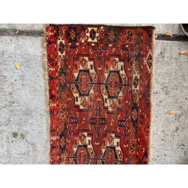 This handmade antique Turkmen Tekke Torba rug, crafted in the 1840s, is a rare and collectible artifact that showcases the...