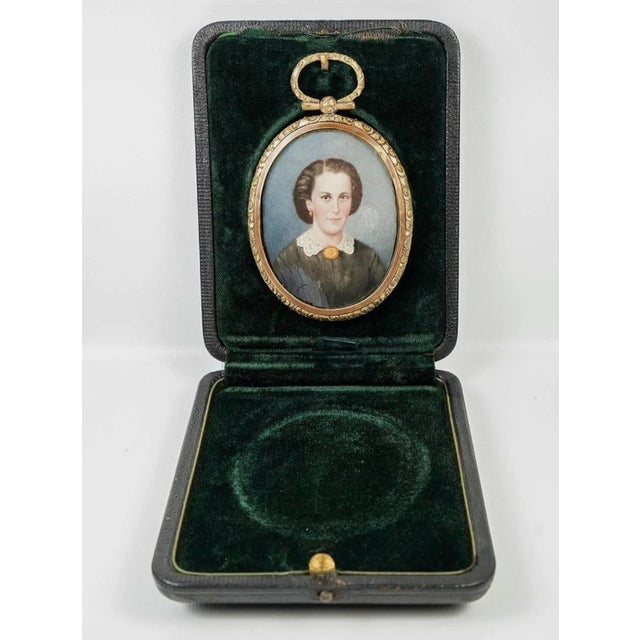 A lovely late Victorian to early Edwardian portrait of a lady, hand painted and housed in the original locket style frame...