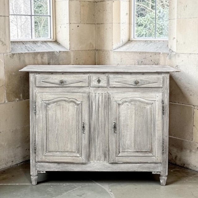 18th Century Directoire Period Country French Whitewashed Buffet is a splendid example of the tailored architecture made...