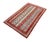 Rich jewel tones and intricate linear patterns define this hand-knotted small area rug. Inspired by traditional Persian...