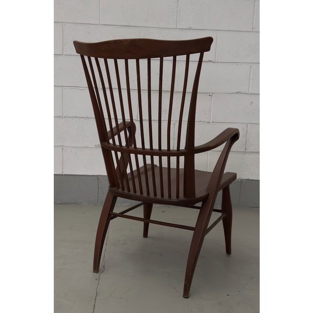 A pair of wooden chairs with spindle backs and turned legs, attributed to architect Maurizio Tempestini. Italy, 1950s....