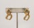 1992 goldtone smooth openwork top with textured openwork link drop pierced push back earrings. Marked "NAPIER©" on the...
