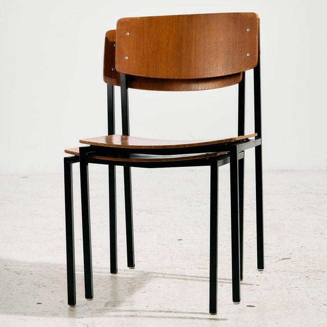Teak chair on metal base from the 1970s. The chair is stackable, so it can also be a good choice for space saving. with...
