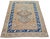 Hand-knotted with care using traditional rug-making techniques, this wool rug blends timeless craftsmanship with a modern...