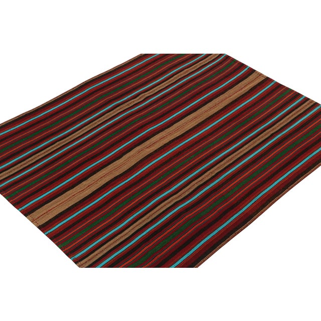 This vintage 6x7 Persian kilim is a mid-century tribal rug, handwoven in wool circa 1950-1960. The design enjoys stripes...