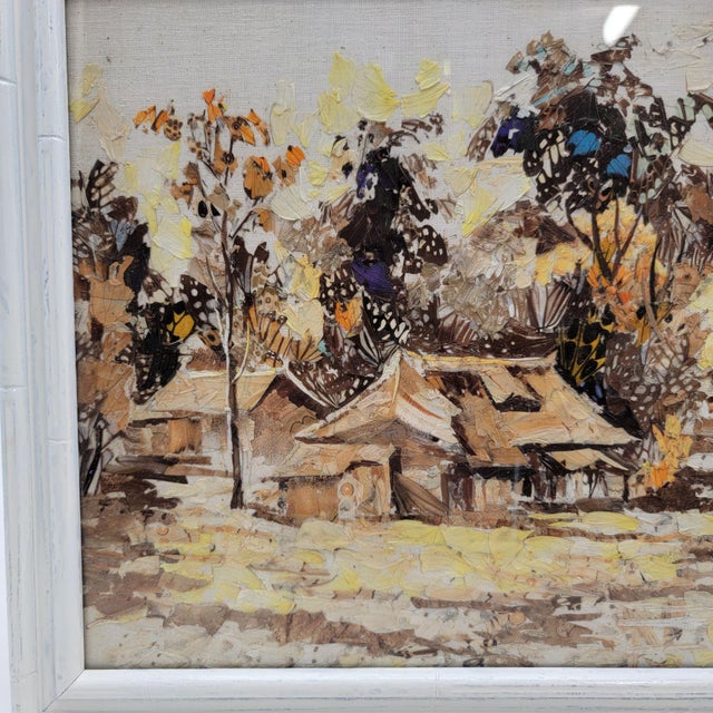 Crafted from real butterfly wings, this exquisite artwork captures a serene Asian village scene. Each intricate detail...