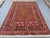 This vibrant Mushwani Maimana kilim features a dense allover lattice of serrated diamonds in a rich, varied palette of...