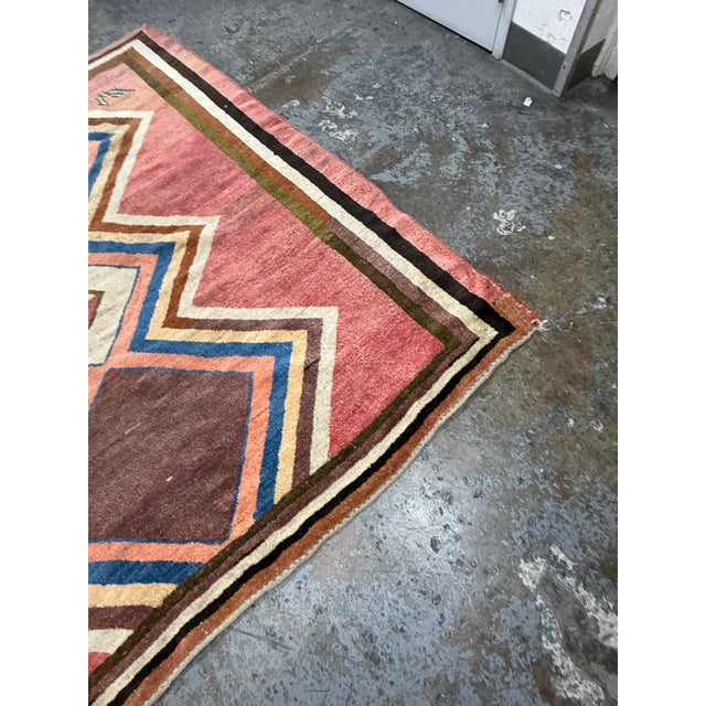 Design Plus Gallery presents a 7ft × 8ft Vintage Hand-Knotted Geometric Wool Area Rug. This vintage wool rug displays a...