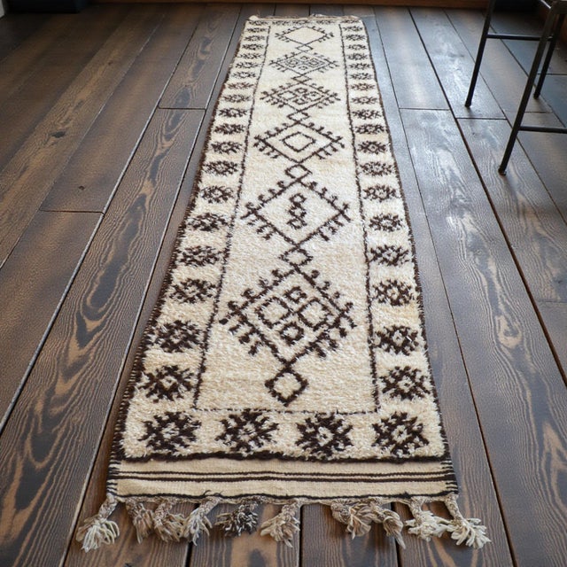 This exceptional 1970s runner rug originates from Southeast Anatolia, hand-knotted by village weavers for personal use...