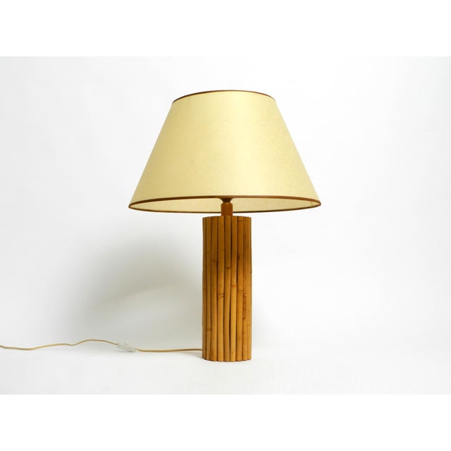 Large 1970s bamboo table lamp with a large paper shade. Beautiful design from the 1960s. Made in Italy. Base is made...