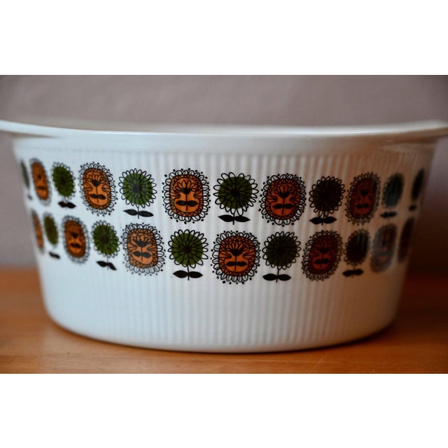 Charming and full of life, this pair of ovenproof porcelain casseroles by Digoin Sarreguemines evokes the joyful spirit of...