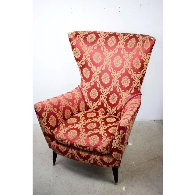 Italian production armchair 60s. The chair is made of wood and fabric. The conditions are good with signs of wear (see...