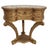 Petite and ornate, this vintage Italian end table features a kidney-shaped top with a decorative motif sealed beneath a...