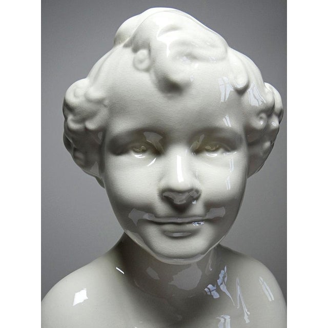 Superb and very rare, a large decorative bust in fine earthenware, glazed in creamy white, with a finely crackled finish....