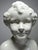 Superb and very rare, a large decorative bust in fine earthenware, glazed in creamy white, with a finely crackled finish....