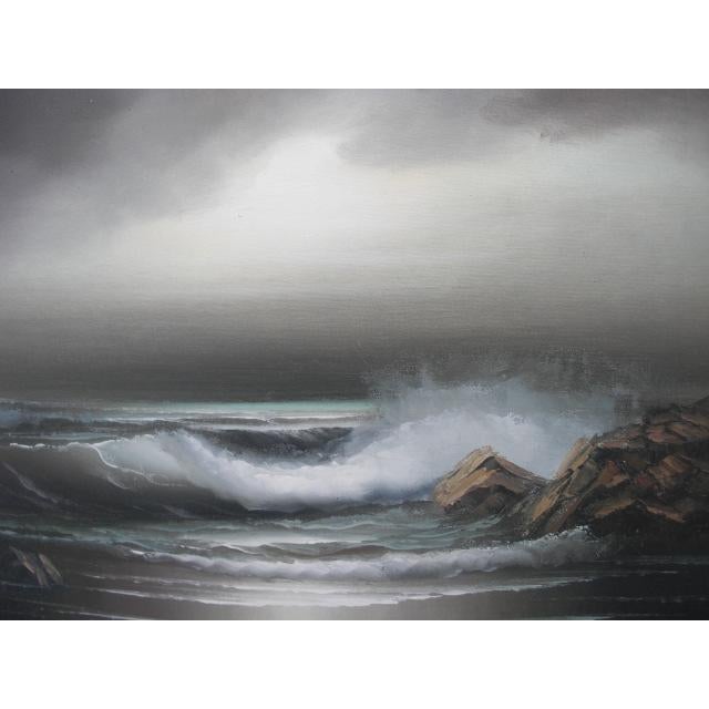This moody, mid century seascape depicts white waves crashing on rocks with cloudy sky and great light, displayed in the...