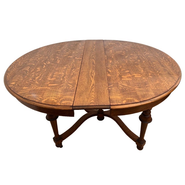 Gorgeous Antique Old English Revival, Round Expansion Table with Turned Baluster legs on casters with curved stretcher...