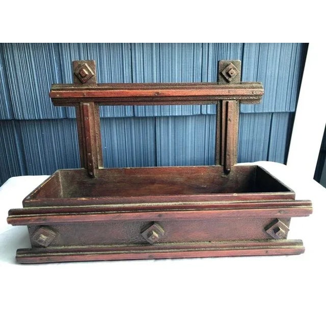 Very unusual folk art wall shelf/pocket with gorgeous color in an oxblood red and wonderful patina. Sweet decorative piece...