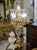Make a dramatic statement with this ornate French-style candelabra lamp, featuring an elaborate gilded structure, faceted...
