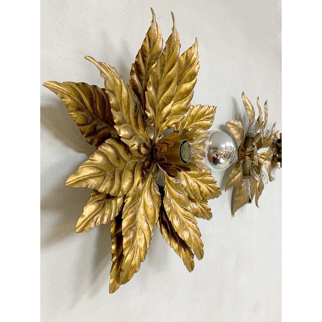 Stay Golden! Pure luxury this elegant vintage wall lamp from the 70s. Especially decorative handmade wall lamp in all...