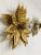 Stay Golden! Pure luxury this elegant vintage wall lamp from the 70s. Especially decorative handmade wall lamp in all...