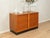 Wonderful chest of drawers from the 1960s by Günter Renkel for Rego Möbel. Teak veneer body with two doors, one shelf, and...