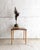This delicate side table dates back to the 1960s and was crafted in the typical minimalist style of the mid-century era....