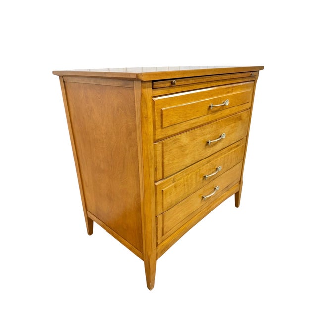 Add authentic mid-century style to your home with this vintage Heywood-Wakefield solid birch chest, circa 1950s. Crafted...