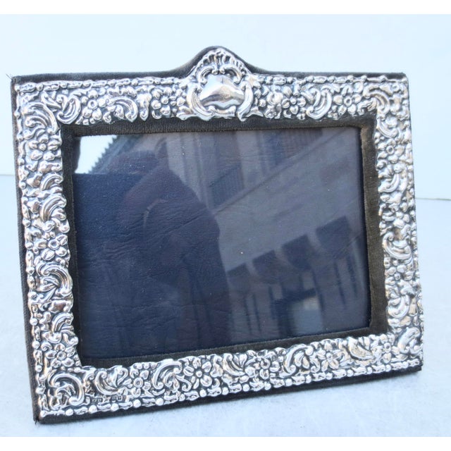 Ornate sterling frame with velvet back and stand. Floral with scrolling designs in a dense textured pattern. Vintage 80s....
