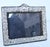 Ornate sterling frame with velvet back and stand. Floral with scrolling designs in a dense textured pattern. Vintage 80s....