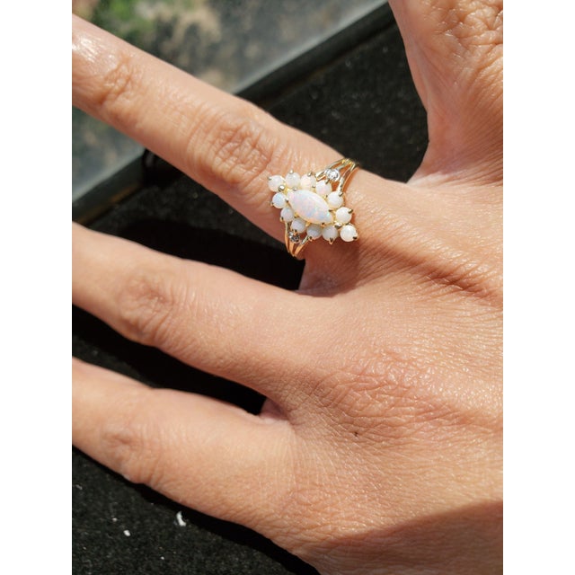 ♥ Product Summary ♥ Main Stone: Australian Opal Band Material: 10k Yellow Gold Stone Cut: Marquise & Round Weight: 2 grams